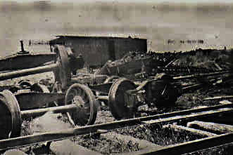 Spare railroad wheel sets at the sawmill.